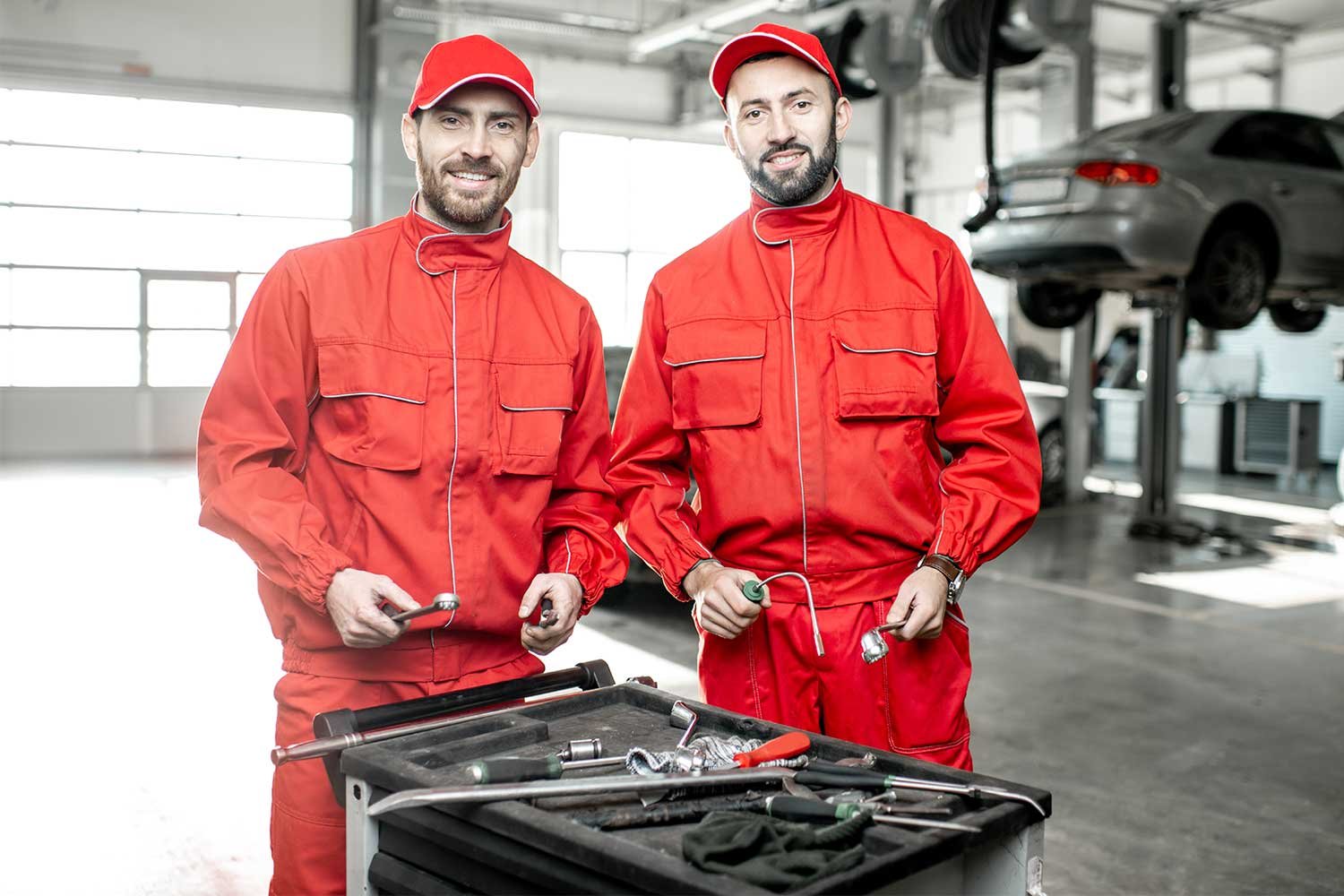 worker-cleaning-modern-vehicle-alloy-wheels