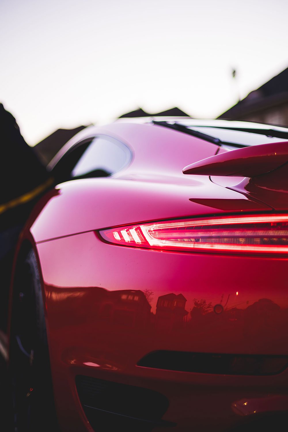 back-view-of-red-porsche-in-street