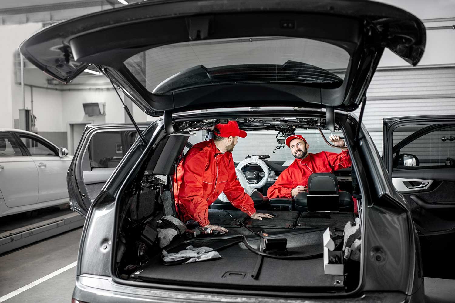 worker-cleaning-automobile-air-conditioner-vent-gr